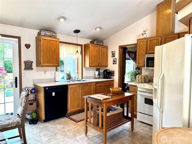 1711 Mount Rainier Blvd, Spanaway, WA 98387 - kitchen featuring white appliances, a sink, lofted ceiling, light countertops, and brown cabinetry