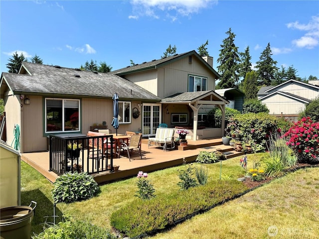 1711 Mount Rainier Blvd, Spanaway, WA 98387 - back of property featuring a yard, a chimney, a deck, roof with shingles, and an outdoor living space