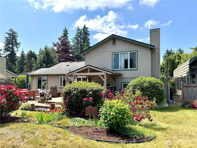 1711 Mount Rainier Blvd, Spanaway, WA 98387 - back of house with a chimney and a patio area
