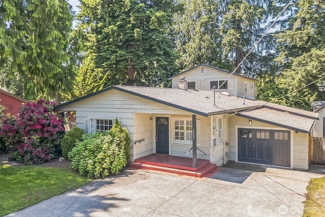 13257 4th Ave S, Burien, WA 98168 - view of front of house with roof with shingles and a porch
