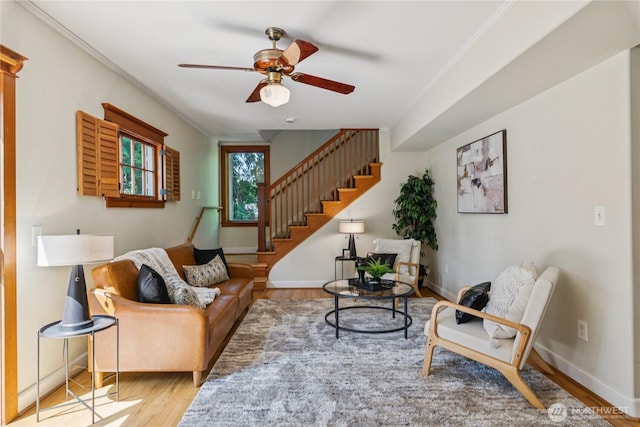 13257 4th Ave S, Burien, WA 98168 - living room featuring wood finished floors, ceiling fan, stairway, baseboards, and ornamental molding