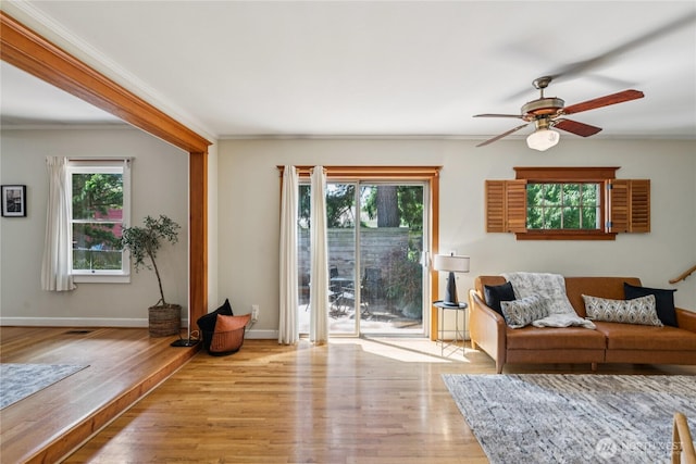 13257 4th Ave S, Burien, WA 98168 - living room featuring wood finished floors, ceiling fan, crown molding, and baseboards