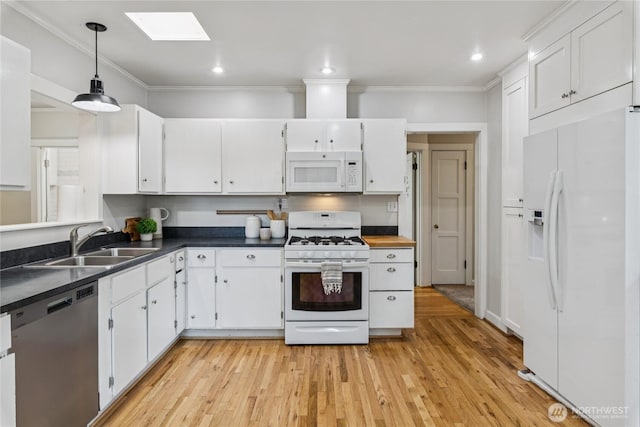 13257 4th Ave S, Burien, WA 98168 - kitchen with white appliances, a sink, white cabinets, ornamental molding, and light wood-type flooring