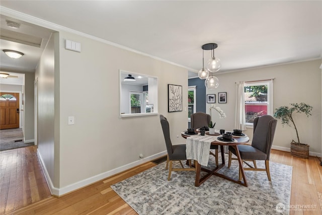 13257 4th Ave S, Burien, WA 98168 - dining space featuring healthy amount of natural light, baseboards, light wood-style flooring, and crown molding