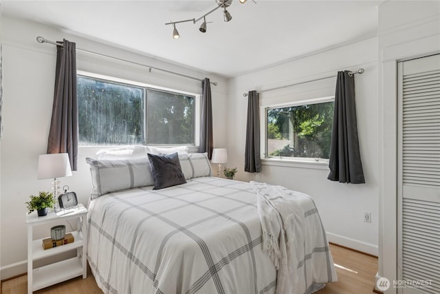 13257 4th Ave S, Burien, WA 98168 - bedroom with baseboards, wood finished floors, and a closet
