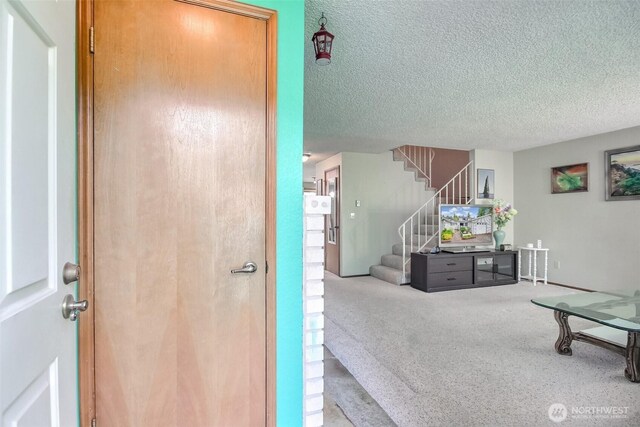 152 S 324th Pl Unit 65, Federal Way, WA 98003 - interior space featuring carpet flooring, stairs, and a textured ceiling