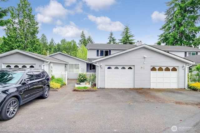 152 S 324th Pl Unit 65, Federal Way, WA 98003 - view of front of home with asphalt driveway and an attached garage