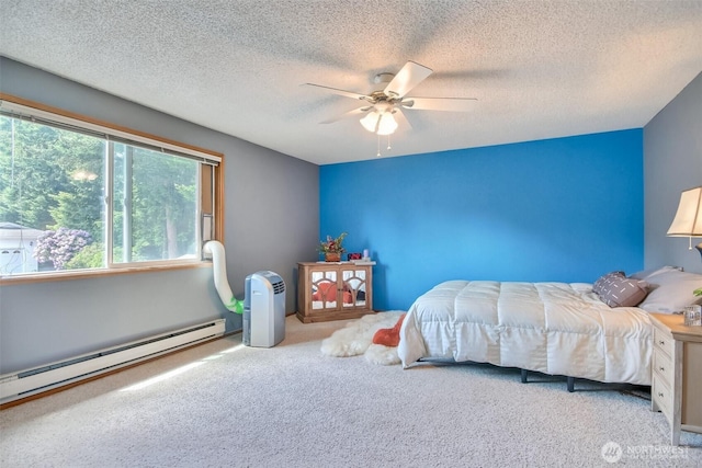 152 S 324th Pl Unit 65, Federal Way, WA 98003 - bedroom featuring carpet, a baseboard radiator, a textured ceiling, and a ceiling fan