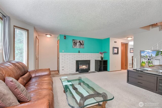152 S 324th Pl Unit 65, Federal Way, WA 98003 - living area featuring a textured ceiling, a fireplace, and carpet
