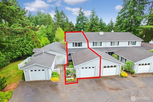 152 S 324th Pl Unit 65, Federal Way, WA 98003 - view of front of house with a chimney and a detached garage