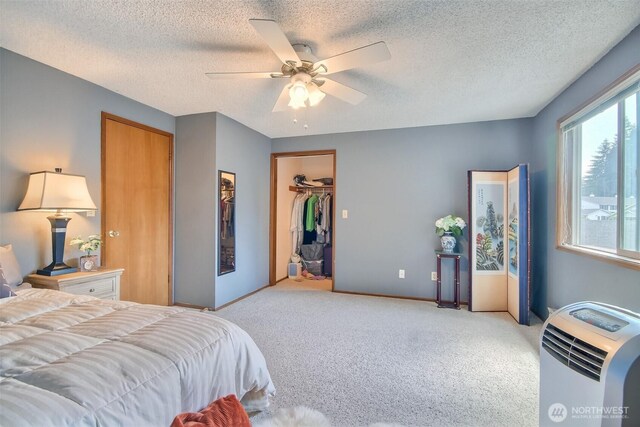 152 S 324th Pl Unit 65, Federal Way, WA 98003 - bedroom with carpet floors, a ceiling fan, baseboards, a textured ceiling, and a closet
