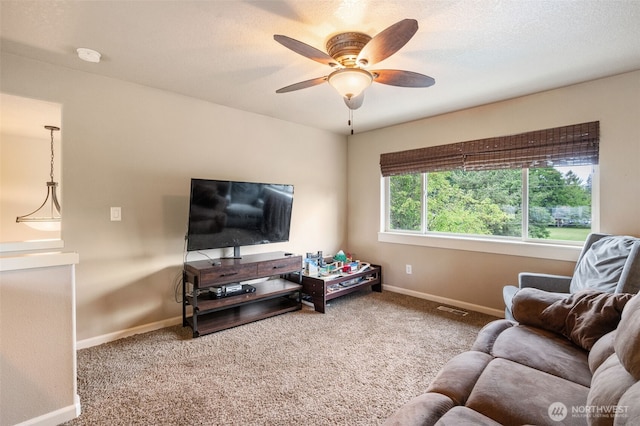 11 NW 25th St, Battle Ground, WA 98604 - living area with a ceiling fan, carpet flooring, and baseboards