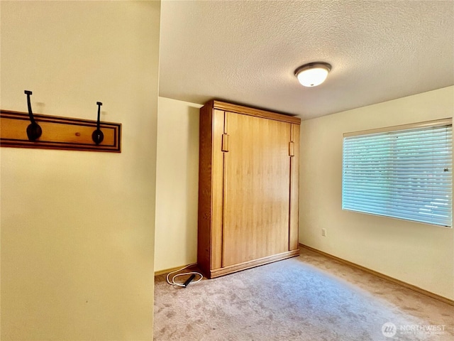 30211 O Pl, Ocean Park, WA 98640 - unfurnished bedroom featuring a textured ceiling, carpet flooring, and baseboards