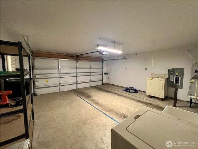 30211 O Pl, Ocean Park, WA 98640 - garage featuring washer / clothes dryer, a garage door opener, and electric panel