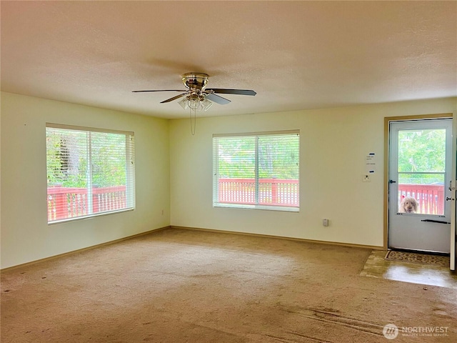 30211 O Pl, Ocean Park, WA 98640 - carpeted spare room featuring ceiling fan, baseboards, and a textured ceiling