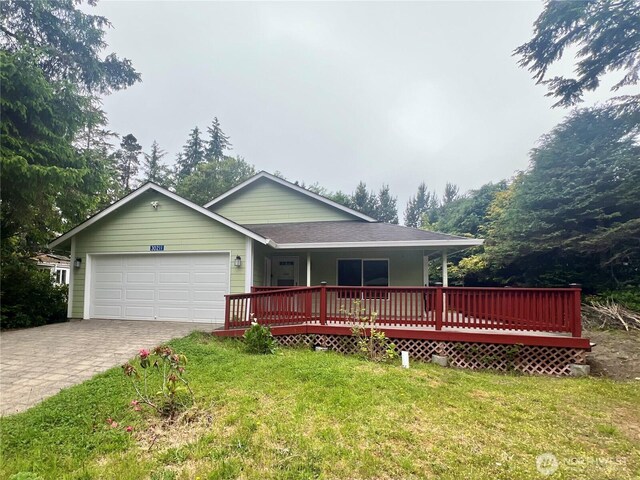 30211 O Pl, Ocean Park, WA 98640 - single story home featuring an attached garage, a front yard, decorative driveway, a porch, and a shingled roof