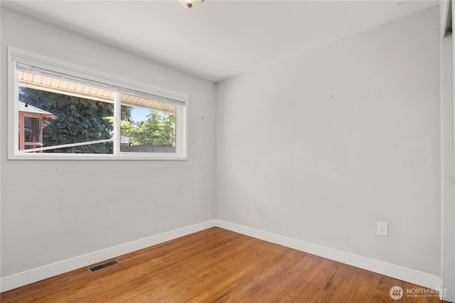17004 11th Ave NE, Shoreline, WA 98155 - spare room with baseboards and wood finished floors