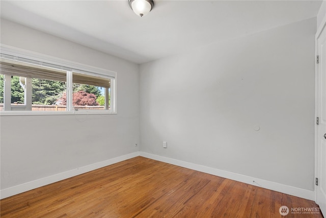 17004 11th Ave NE, Shoreline, WA 98155 - unfurnished room with baseboards and wood finished floors