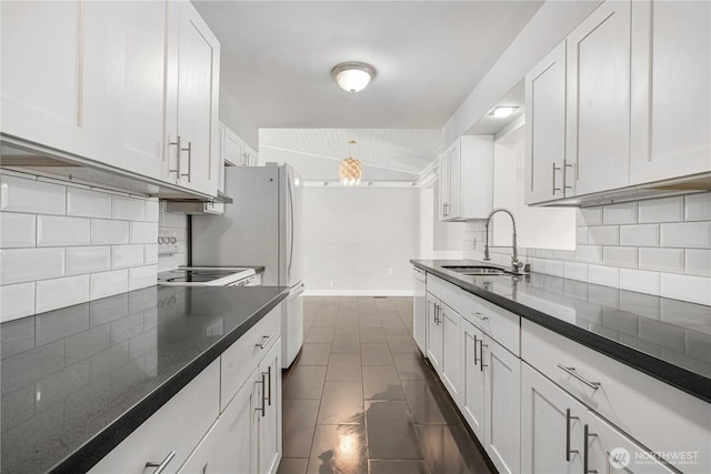 17004 11th Ave NE, Shoreline, WA 98155 - kitchen featuring a sink, white cabinetry, white appliances, decorative backsplash, and vaulted ceiling