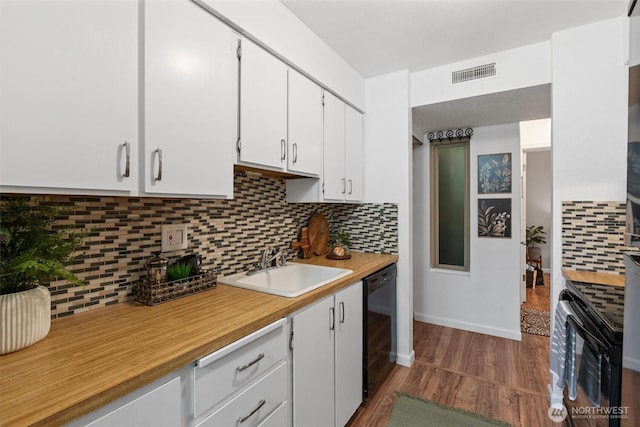 12515 NE 145th Pl Unit D121, Kirkland, WA 98034 - kitchen with dishwasher, a sink, light countertops, white cabinetry, and dark wood finished floors
