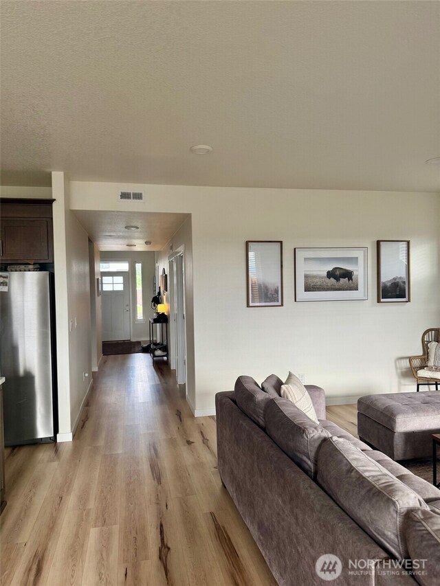603 Cardinal Ave, Winlock, WA 98596 - living room featuring light wood-type flooring and baseboards