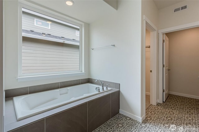 603 Cardinal Ave, Winlock, WA 98596 - full bathroom with a garden tub, tile patterned floors, and baseboards