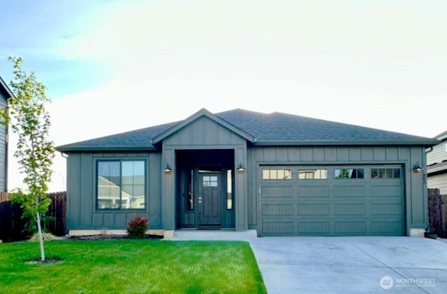 603 Cardinal Ave, Winlock, WA 98596 - single story home featuring a garage, concrete driveway, board and batten siding, and a shingled roof
