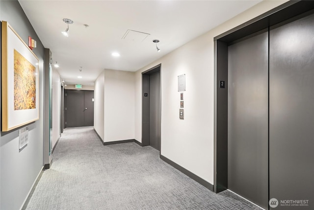 2929 1st Ave Unit 205, Seattle, WA 98121 - corridor with elevator and carpet