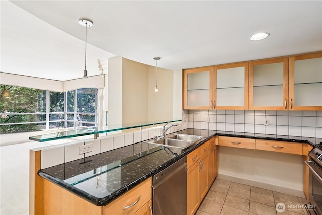 2929 1st Ave Unit 205, Seattle, WA 98121 - kitchen featuring stainless steel appliances, decorative light fixtures, dark stone counters, backsplash, and glass insert cabinets