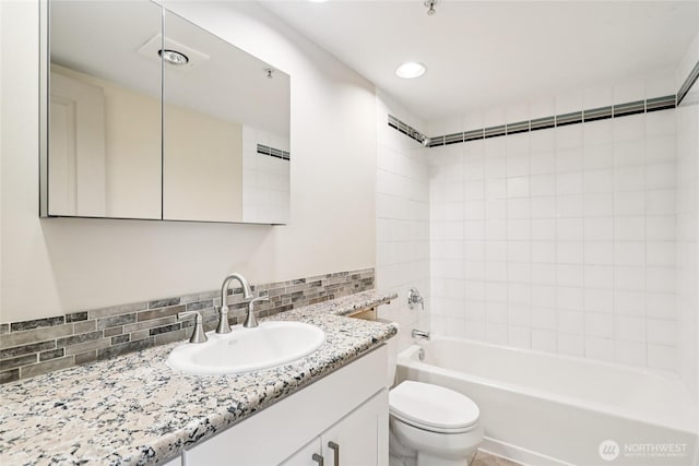 2929 1st Ave Unit 205, Seattle, WA 98121 - bathroom featuring vanity, decorative backsplash, tub / shower combination, and recessed lighting