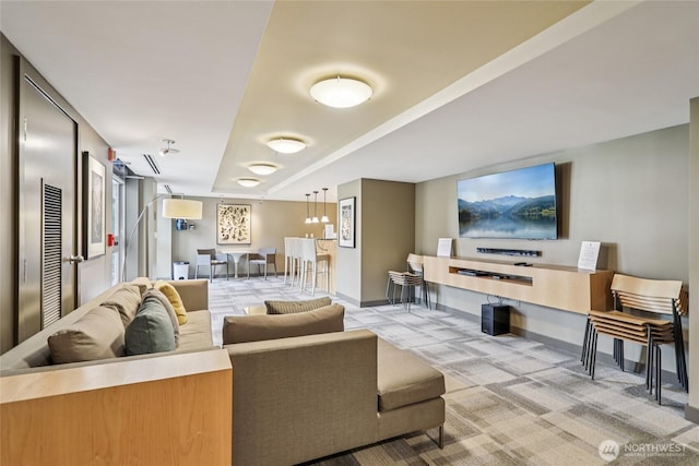 2929 1st Ave Unit 205, Seattle, WA 98121 - living area with baseboards and light colored carpet