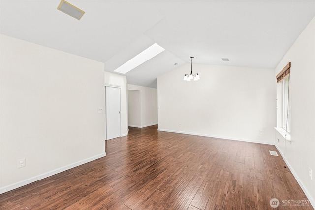 5937 Danials Loop SE, Lacey, WA 98513 - spare room featuring a chandelier, lofted ceiling, and hardwood / wood-style flooring