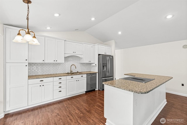 5937 Danials Loop SE, Lacey, WA 98513 - kitchen with stainless steel appliances, lofted ceiling, white cabinets, decorative backsplash, and dark wood-style floors