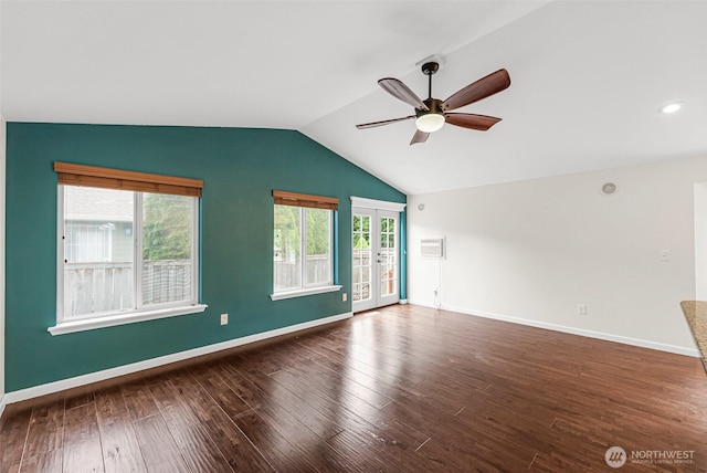 5937 Danials Loop SE, Lacey, WA 98513 - unfurnished living room with ceiling fan, french doors, wood finished floors, vaulted ceiling, and a wall mounted AC