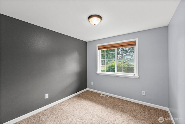 5937 Danials Loop SE, Lacey, WA 98513 - spare room featuring carpet and baseboards