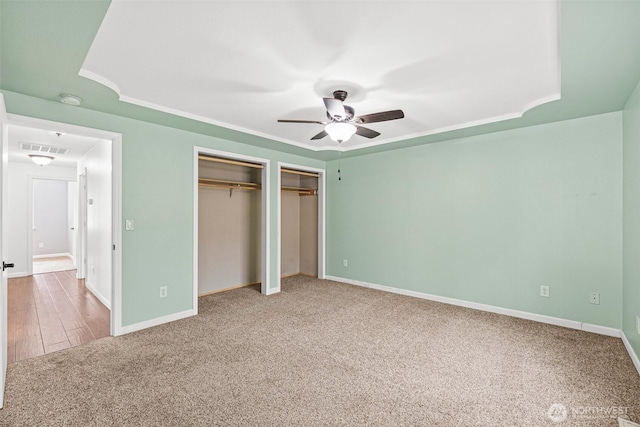 5937 Danials Loop SE, Lacey, WA 98513 - unfurnished bedroom with carpet floors, two closets, and ceiling fan