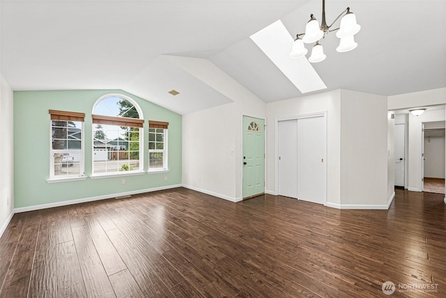 5937 Danials Loop SE, Lacey, WA 98513 - unfurnished living room featuring lofted ceiling, a skylight, wood-type flooring, and a chandelier