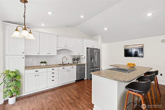 5937 Danials Loop SE, Lacey, WA 98513 - kitchen featuring stainless steel appliances, lofted ceiling, tasteful backsplash, white cabinets, and dark wood-style flooring