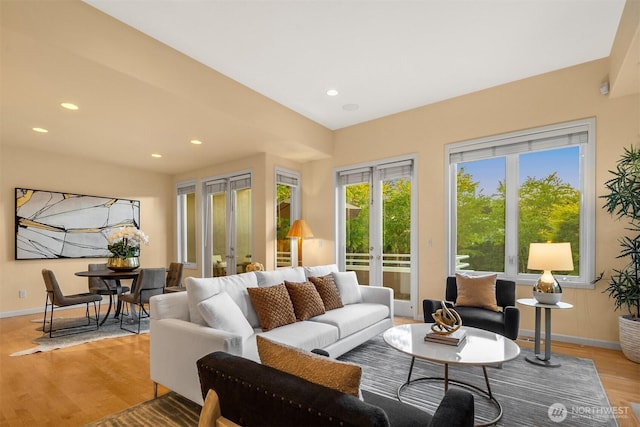 740 1st St S, Kirkland, WA 98033 - living room with french doors, light wood finished floors, and recessed lighting