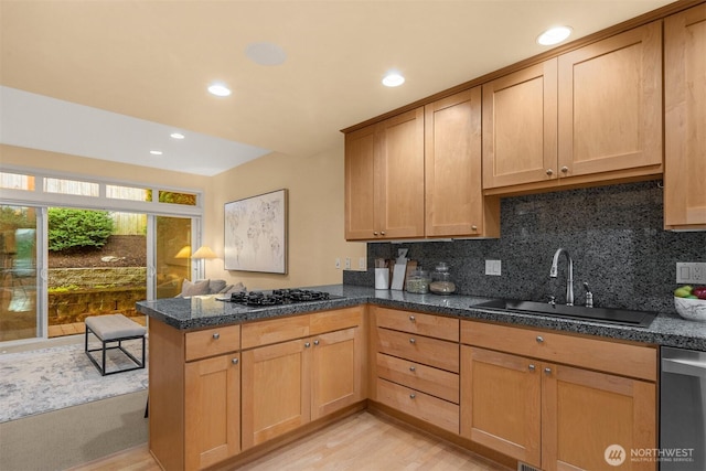 740 1st St S, Kirkland, WA 98033 - kitchen featuring a peninsula, dishwasher, light wood-type flooring, gas stovetop, and decorative backsplash