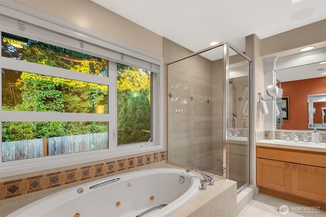 740 1st St S, Kirkland, WA 98033 - full bath featuring a stall shower, vanity, a jetted tub, and tile patterned flooring