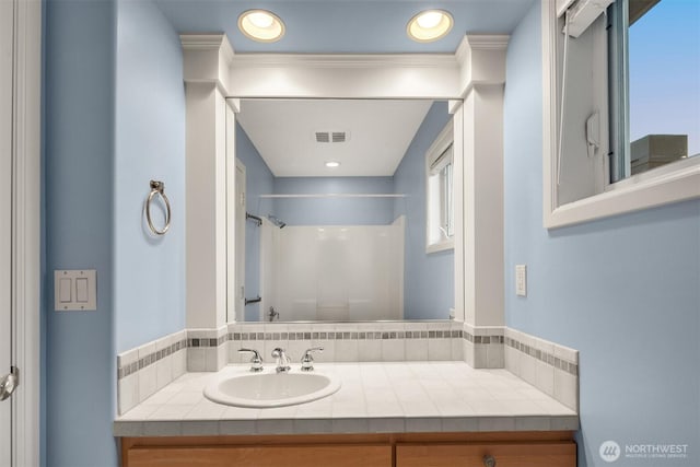 740 1st St S, Kirkland, WA 98033 - bathroom with a shower, vanity, and recessed lighting