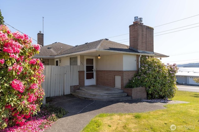 1001 S 226th St, Des Moines, WA 98198 - view of front facade with a chimney, brick siding, and a shingled roof