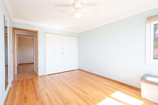 1001 S 226th St, Des Moines, WA 98198 - unfurnished bedroom featuring light wood-style flooring, a closet, baseboards, ornamental molding, and ceiling fan