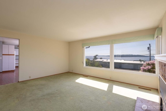 1001 S 226th St, Des Moines, WA 98198 - carpeted empty room with baseboards and a fireplace