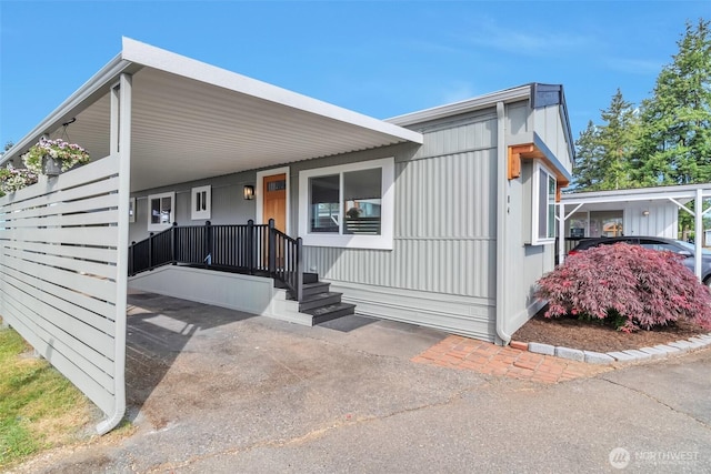 18501 52nd Ave W Unit 84, Lynnwood, WA 98037 - manufactured / mobile home with an attached carport
