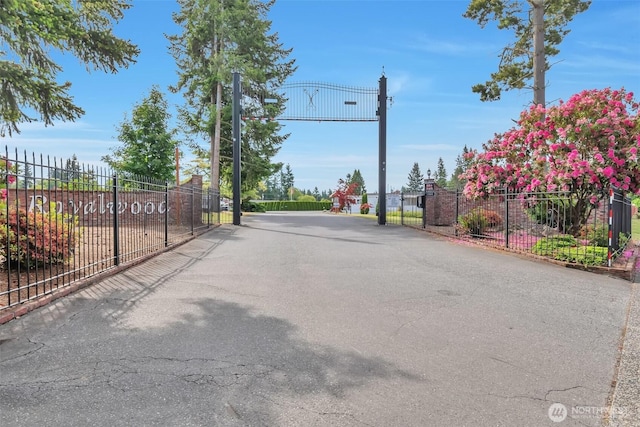 18501 52nd Ave W Unit 84, Lynnwood, WA 98037 - view of asphalt road with a gated entry and a gate