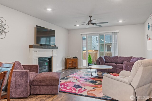 1924 Schneiter Dr, Longview, WA 98632 - living room featuring a ceiling fan, wood finished floors, recessed lighting, and a glass covered fireplace