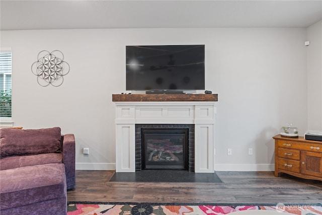 1924 Schneiter Dr, Longview, WA 98632 - living room with dark wood finished floors, a fireplace with flush hearth, and baseboards