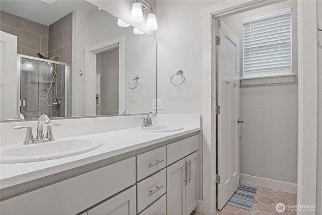 1924 Schneiter Dr, Longview, WA 98632 - full bath with double vanity, a stall shower, tile patterned flooring, and baseboards